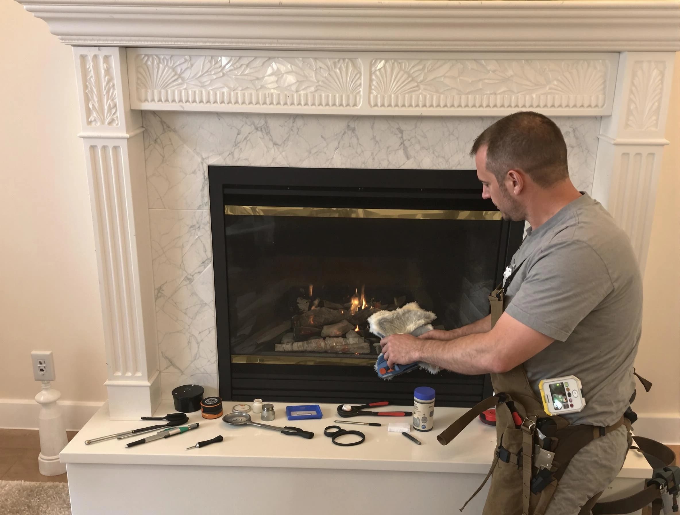 Oakmont Chimney Sweep performing fireplace maintenance in Oakmont, PA